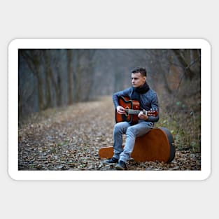 Guitarist singing outdoor in the forest Sticker